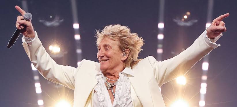 Rod Stewart goes to number one solo while still fronting somebody else's band
