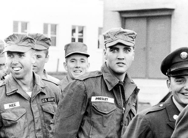 Elvis ships out for Germany and walks the gangplank eight times for the cameras