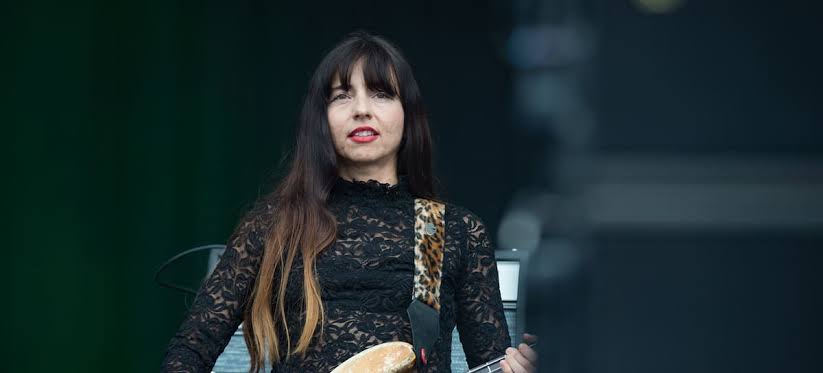 The Pixies dedicate a song to the bassist who left and her replacement sings it